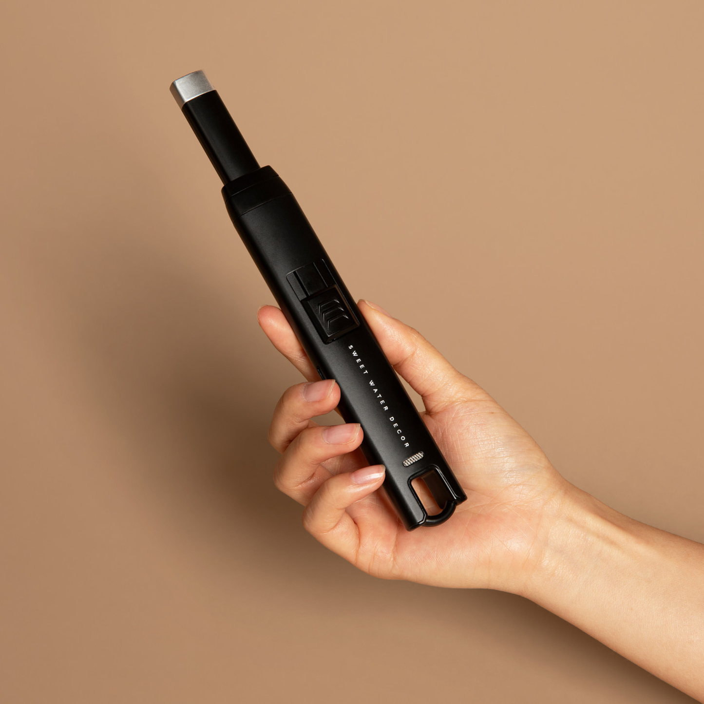 Black Large Rechargeable Electric Lighter held in hand, highlighting its large grip.