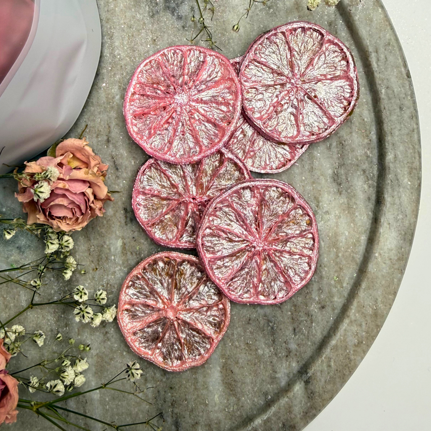 Wicked Inspired pink and green luster-dusted dried lime garnish set, 2-pack.