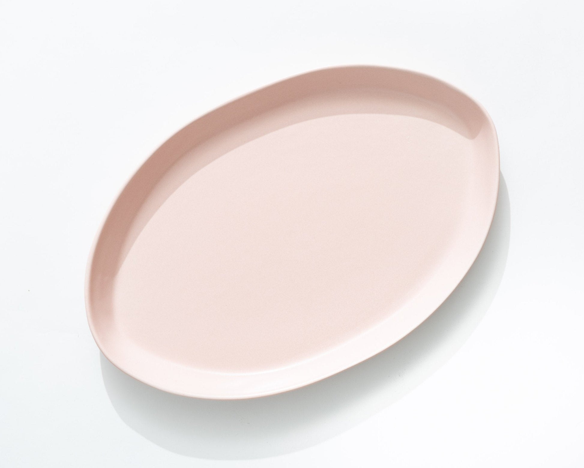 Soft pink oval serving platter, part of a 3-piece serving set.