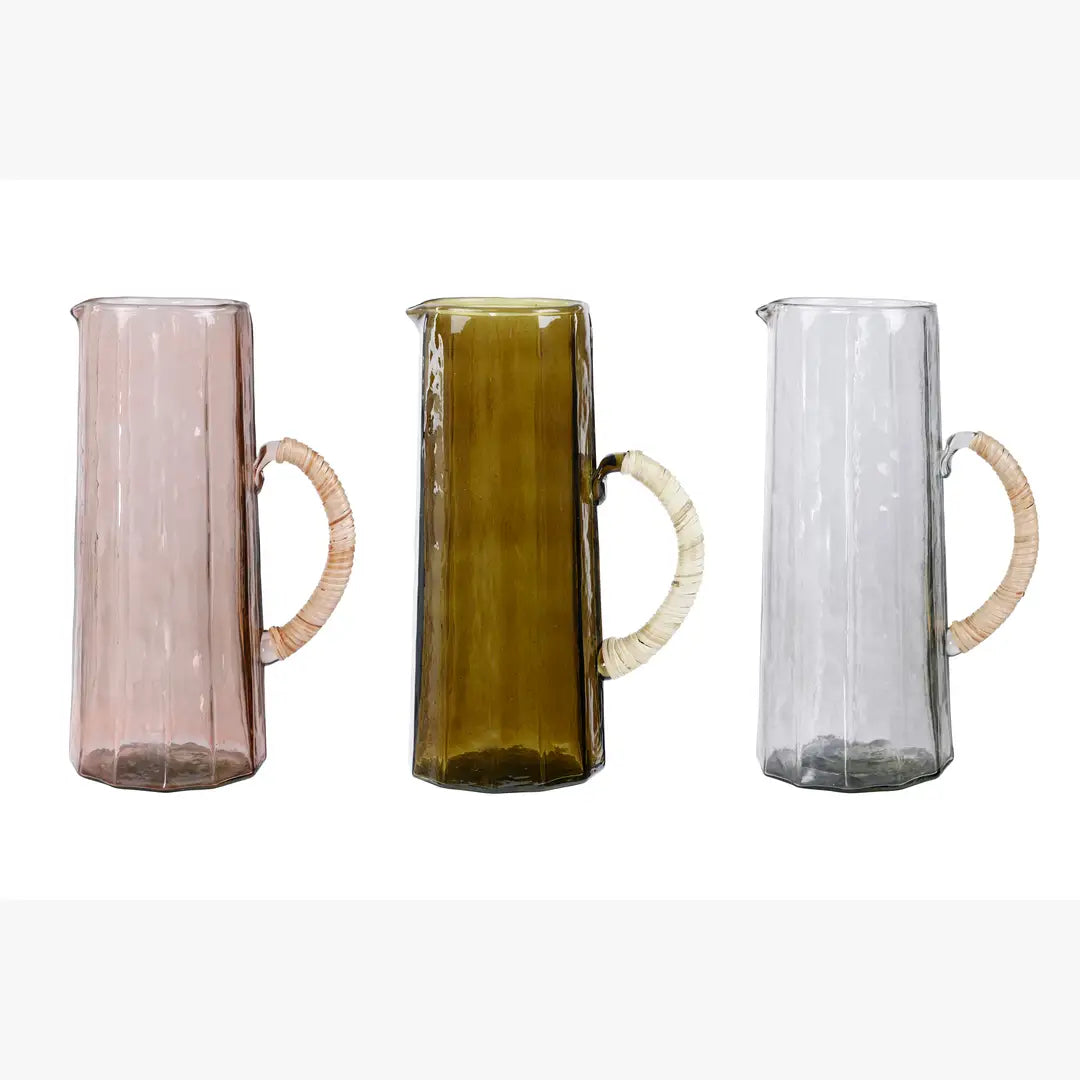Set of three hammered water pitchers in pink, brown, and clear glass with woven handles, 6.25 x 9.5 inches.