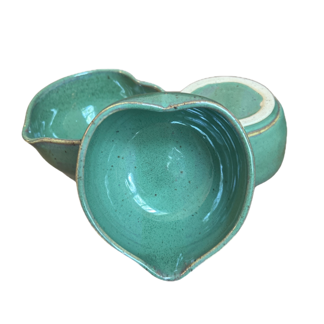 Handcrafted heart-shaped matcha bowl in teal glaze, made in NYC with Marina Caspe.