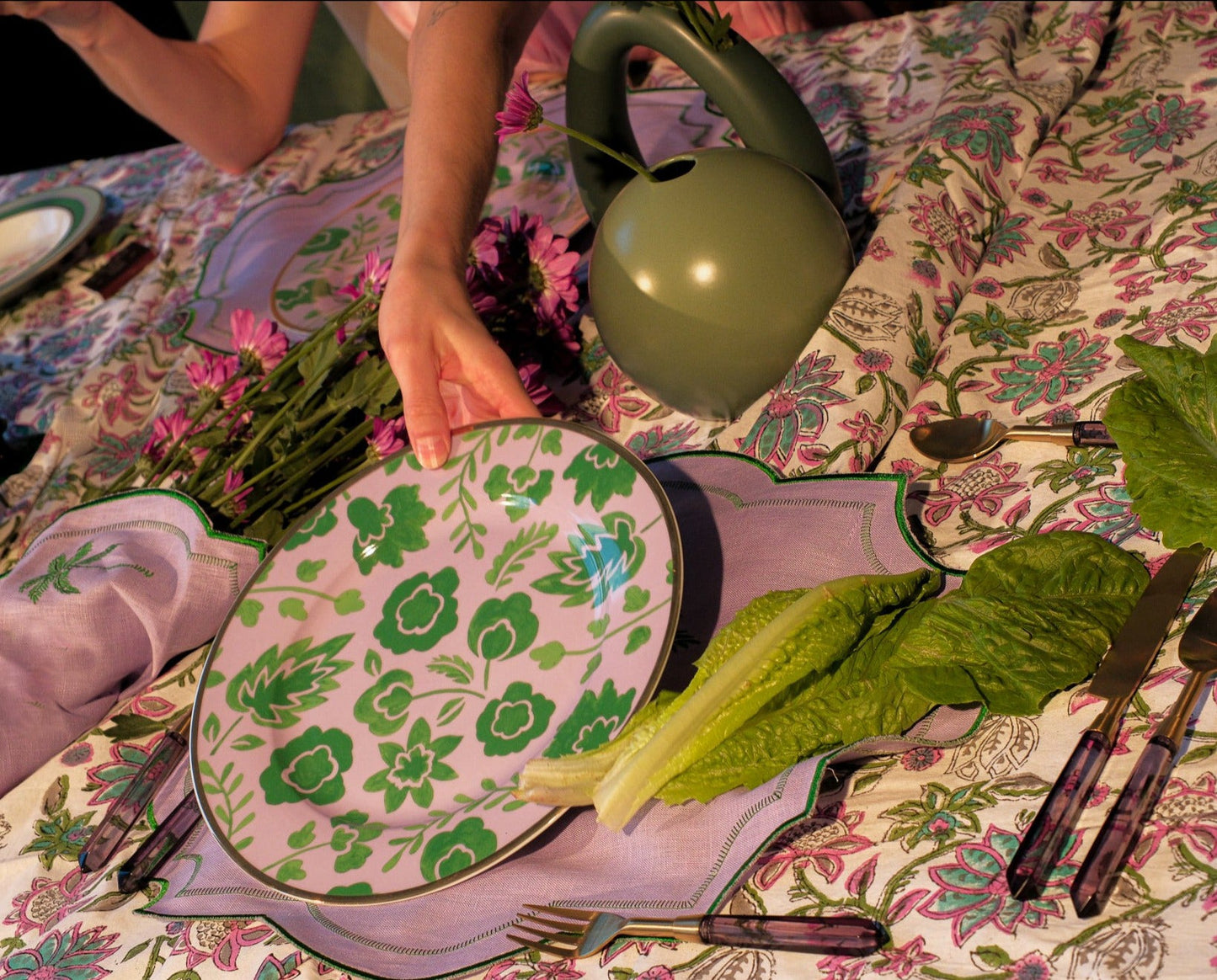 Bernadette Leaf Dinner Plate set: four plates plus a bonus, green leaf pattern on pink, elegant floral table setting.