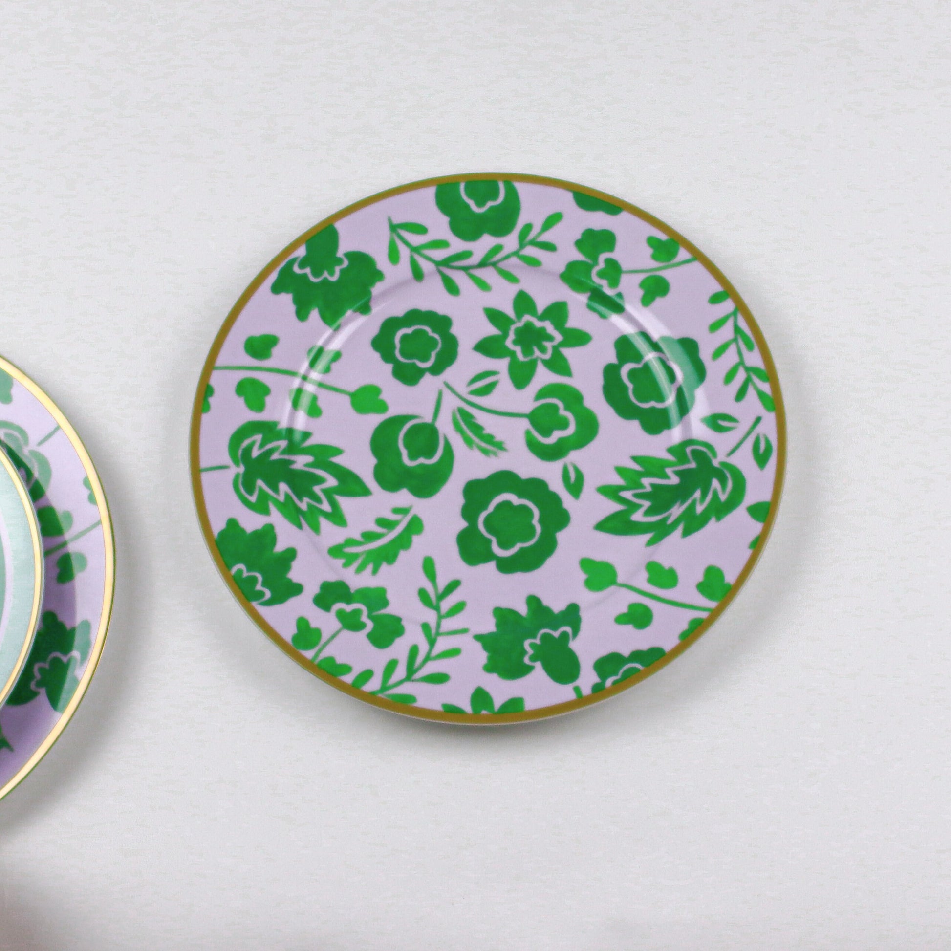 Bernadette Leaf Dinner Plate in lavender with green botanical pattern and gold rim; set of 4 plus 1 bonus plate.