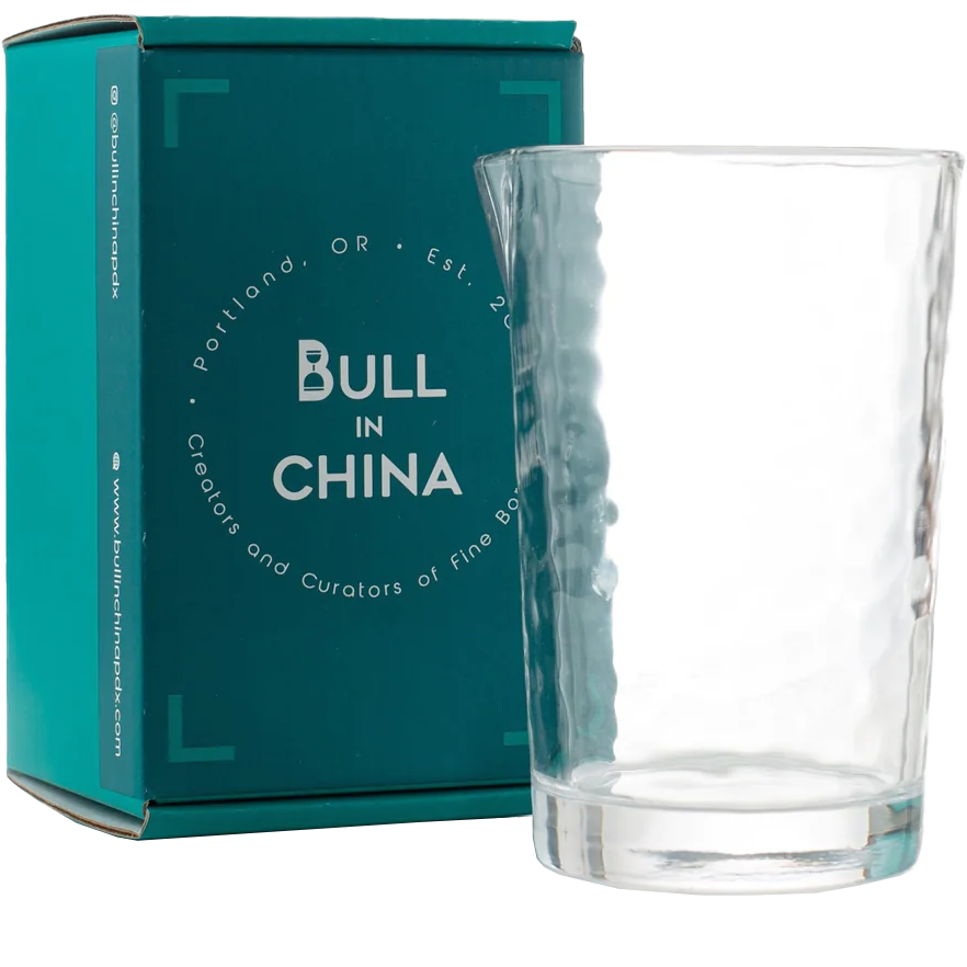 BULL IN CHINA The Flagship annealed mixing glass beside teal box; durable, dishwasher-safe, heat-tolerant.