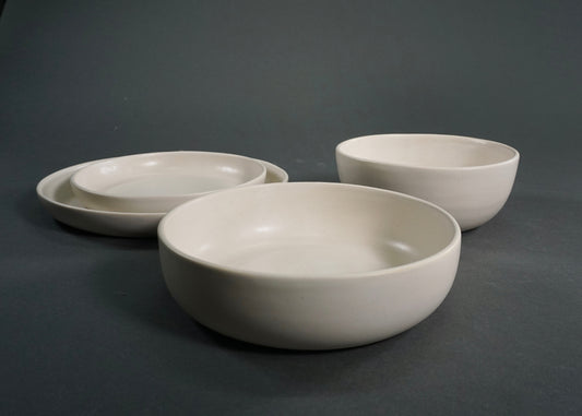 The Dinnerware Set - Ivory: four-piece bowls and plates for breakfast, lunch, and dinner.