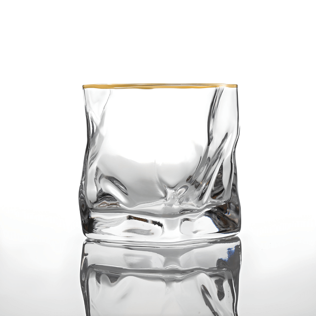 Gold Hoshi Japanese crystal whisky glass with a textured exterior for grip and a gold rim.