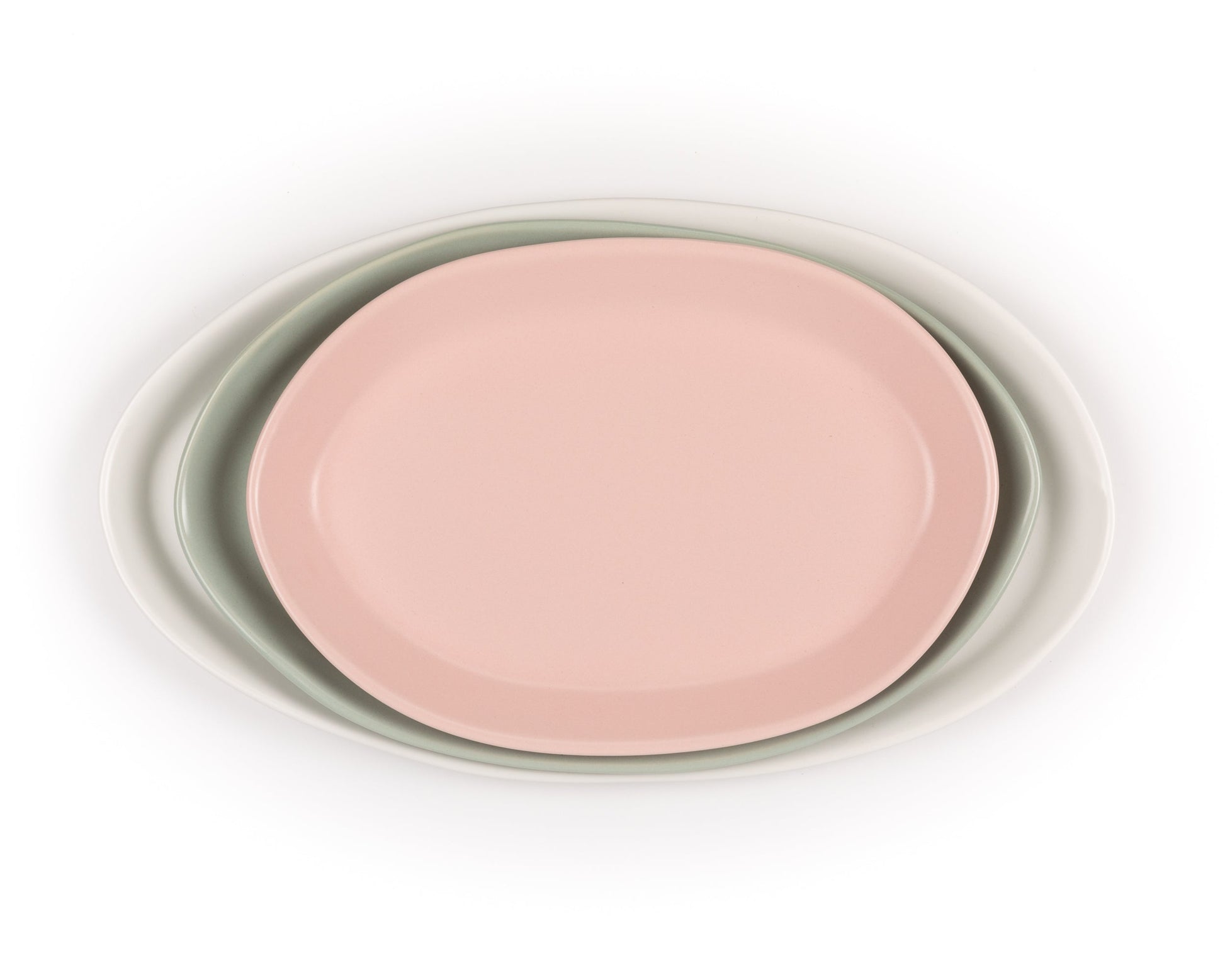 Three-piece oval serving platter set in pink, sage green, and white; nested sizes 13, 15, and 18 inches.