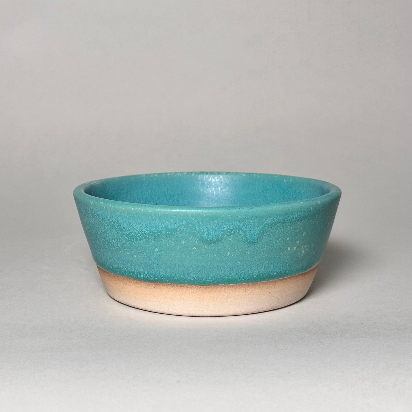 6-inch turquoise ceramic soup bowl with beige base, hand-friendly, ideal for soups, salads, or cereal.