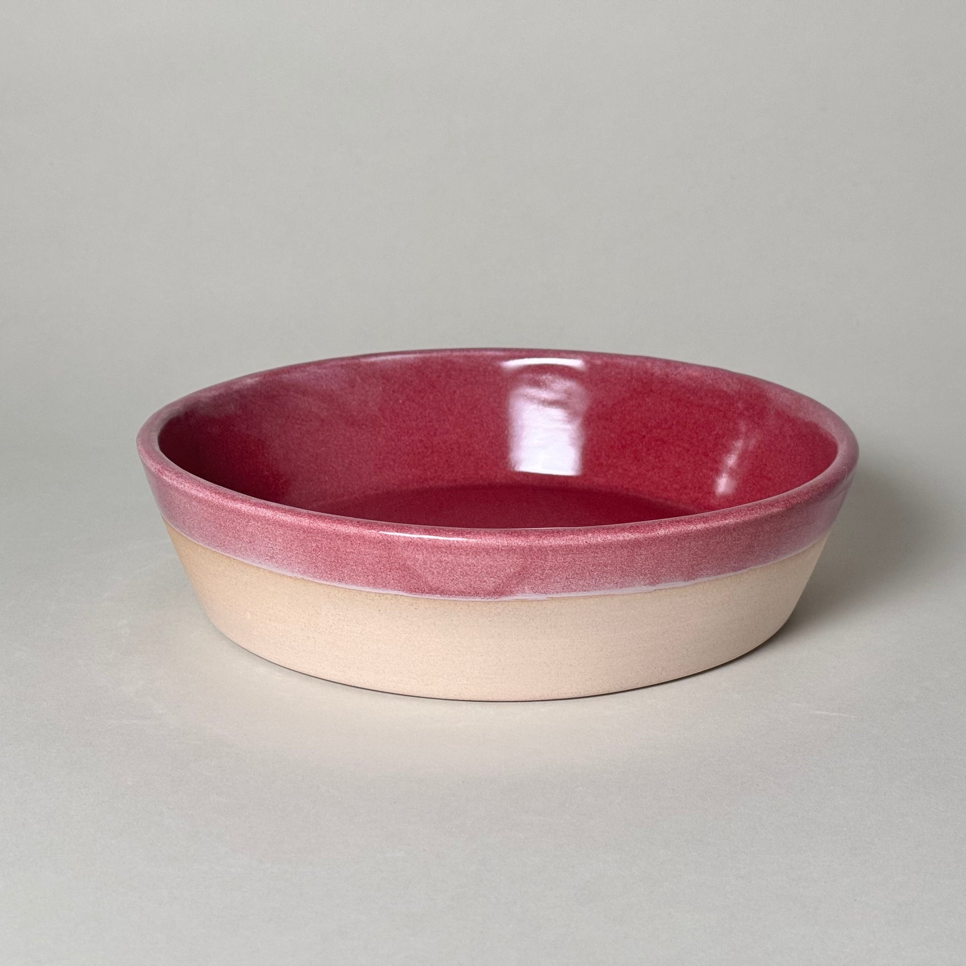Share Bowl - 9.5-inch ceramic serving bowl with pink interior and beige exterior.