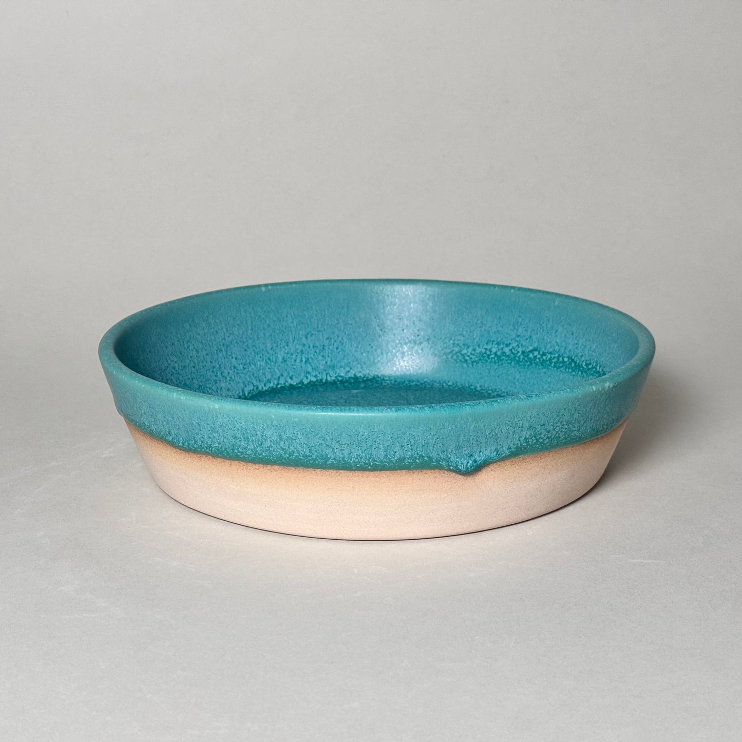 Share Bowl - teal ceramic bowl with a 9.5-inch opening and 2.5-inch depth, perfect for snacks or salads.