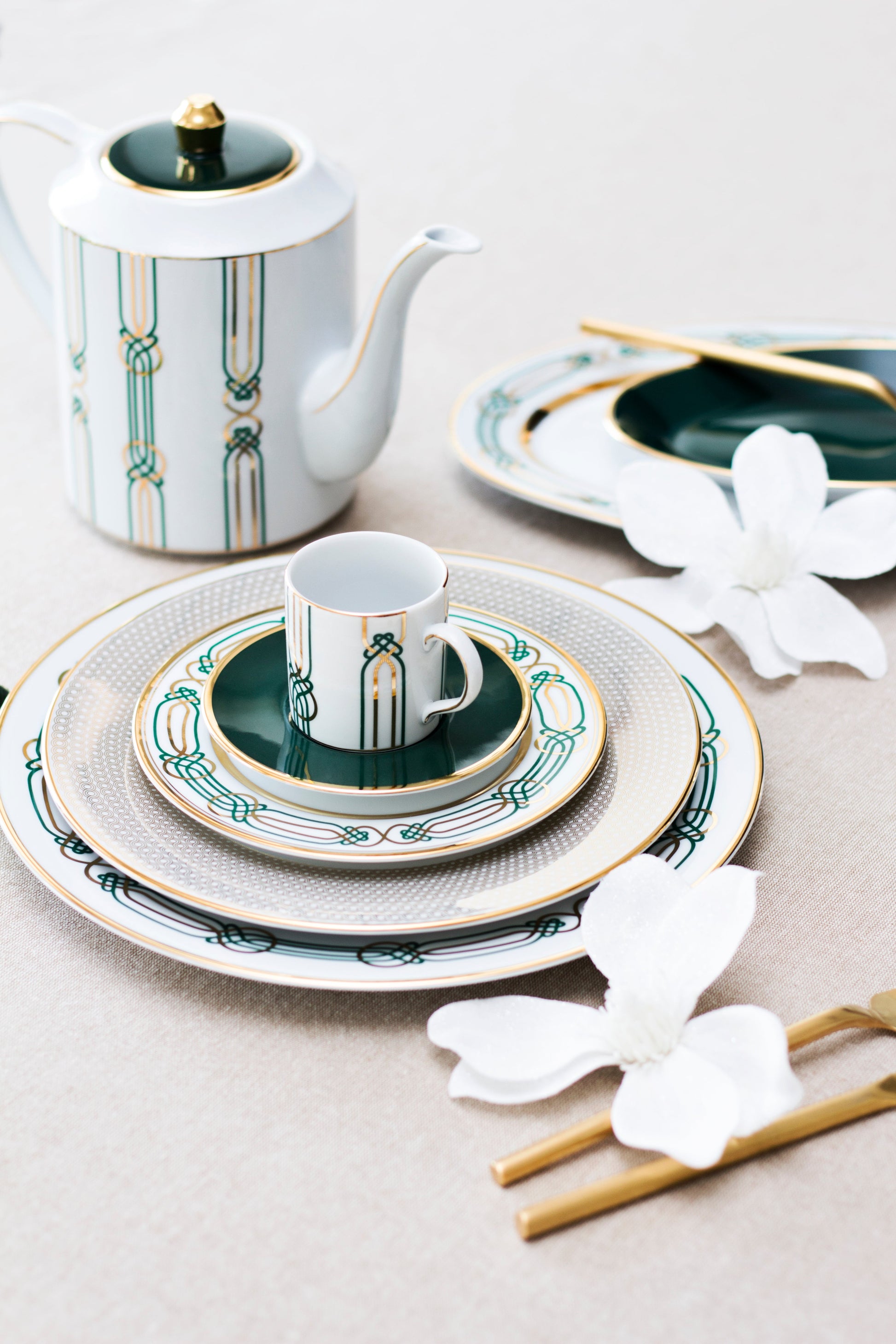 Liberty Tea Pot featuring emerald green arabesque pattern with gold trim, shown with matching porcelain tea set.