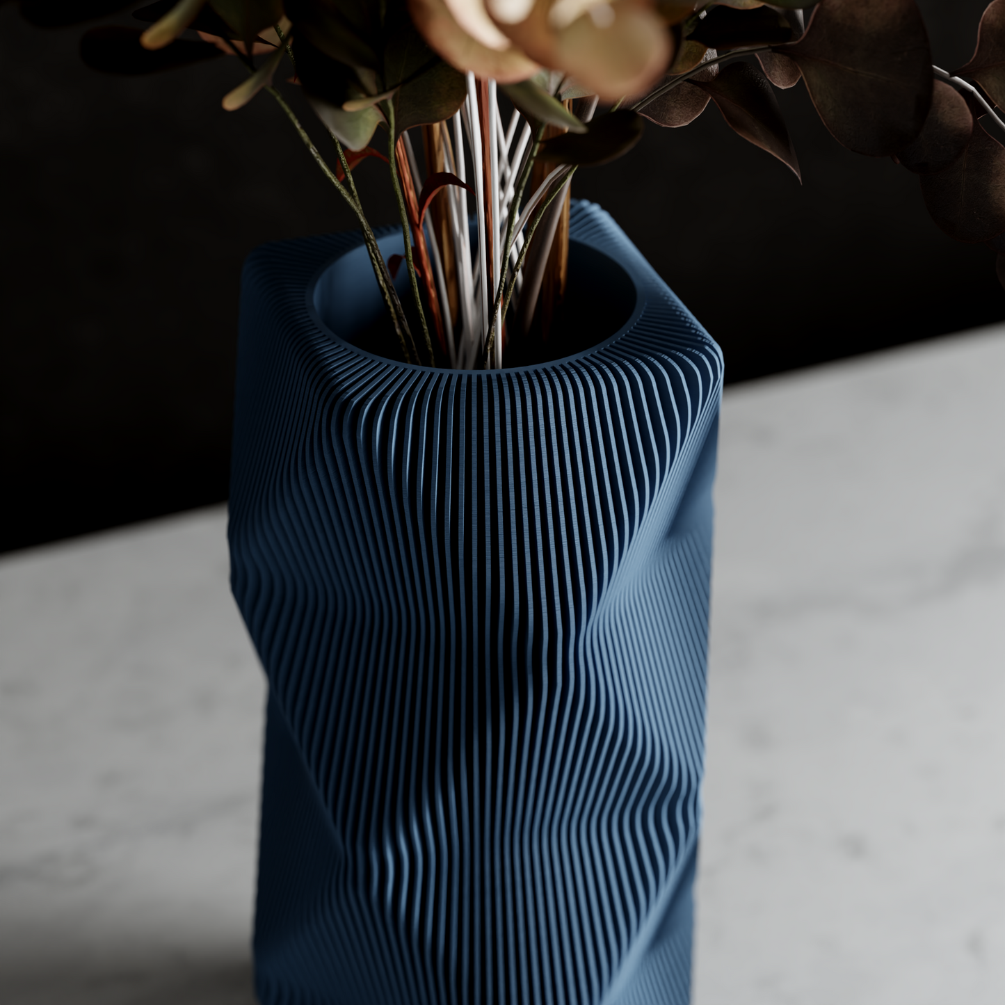 MOUNTAIN Vase in blue with vertical ribbed grooves and a tall angular silhouette holding stems.
