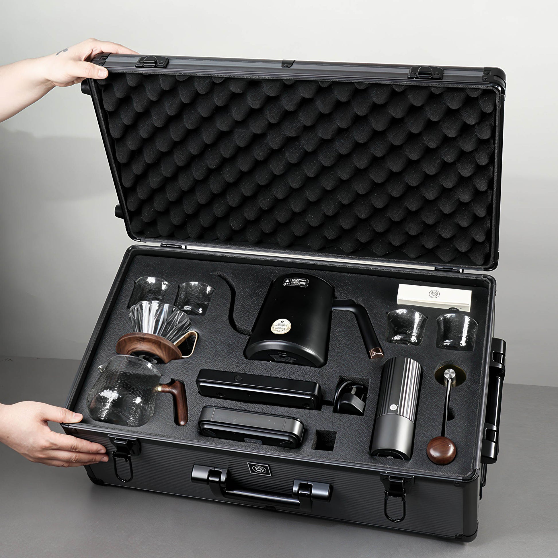 Ultimate Pour Over Coffee Pro Kit stored in a foam-lined hard case with portable brewing gear for travel.