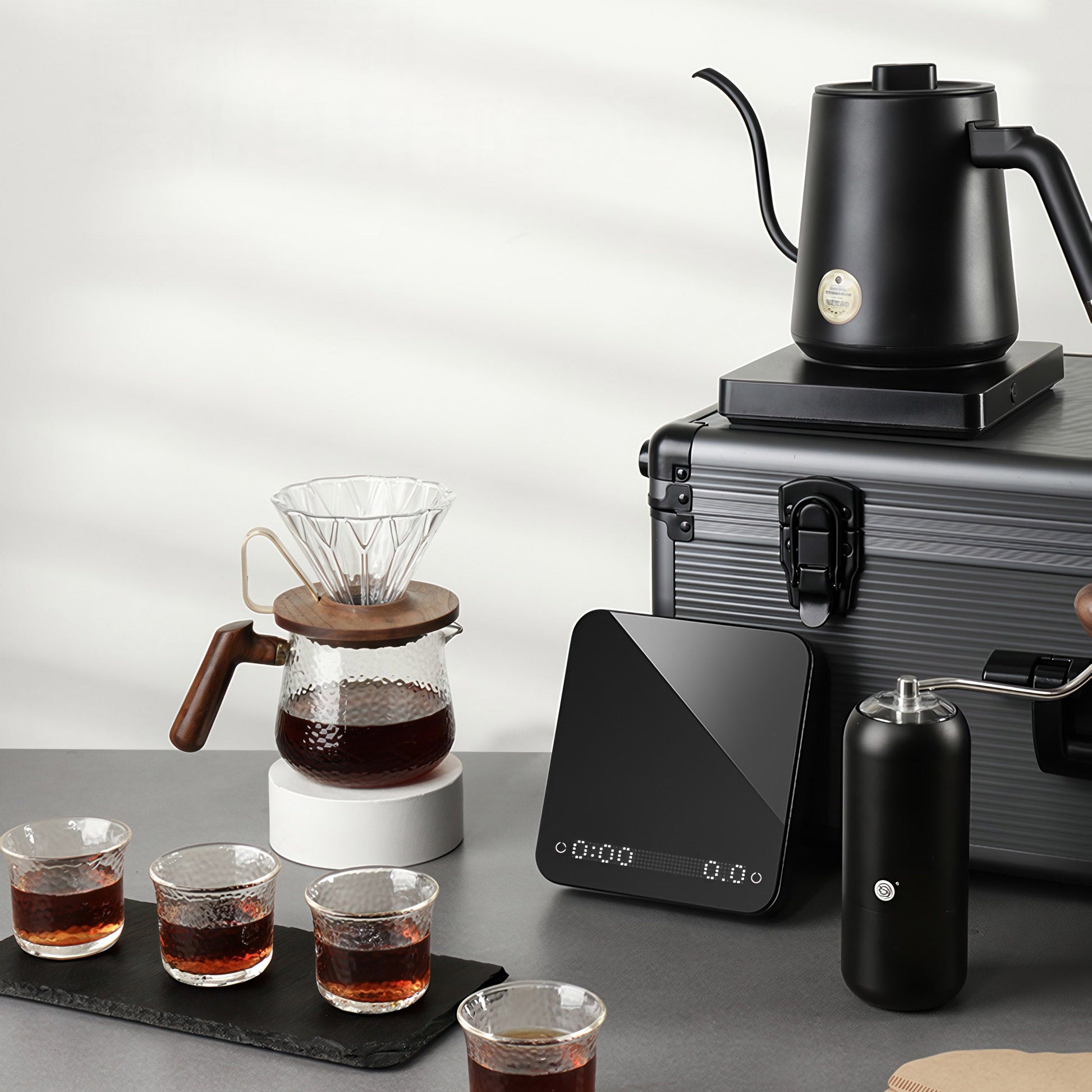 Ultimate Pour Over Coffee Pro Kit: gooseneck kettle, glass carafe, wooden-handled dripper, scale, travel case.