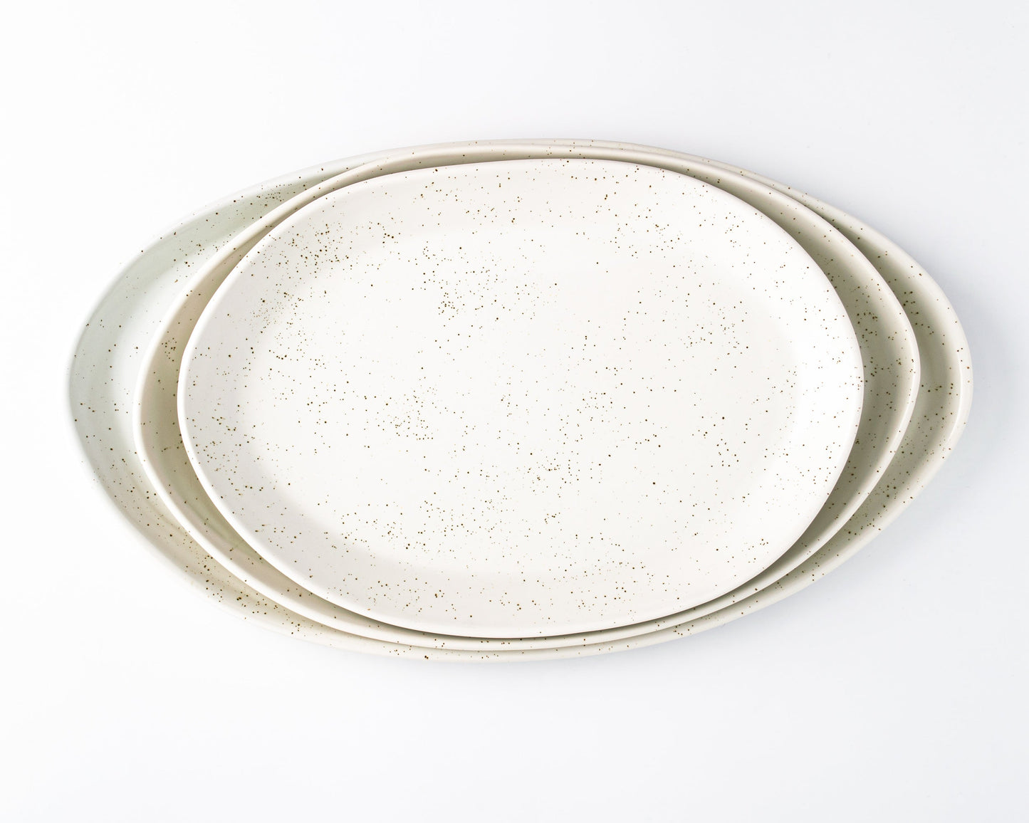 Three oval speckled serving platters in 13", 15", and 18" sizes, stacked together.