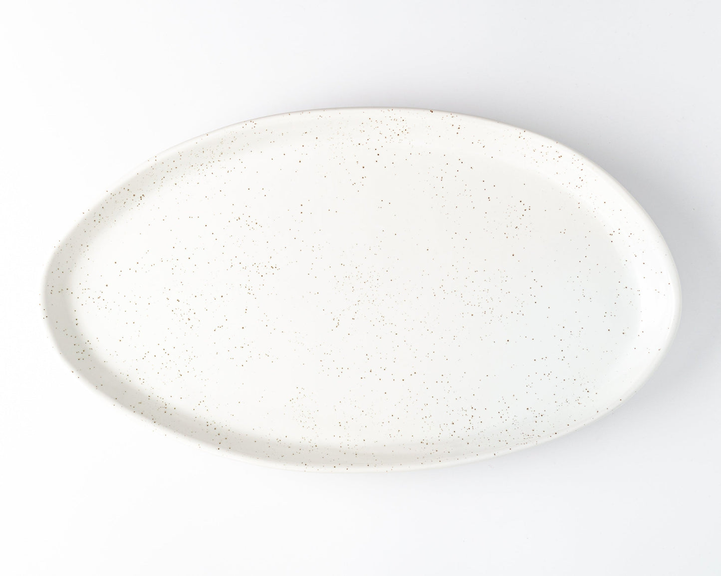 White speckled oval ceramic serving platter for entertaining.