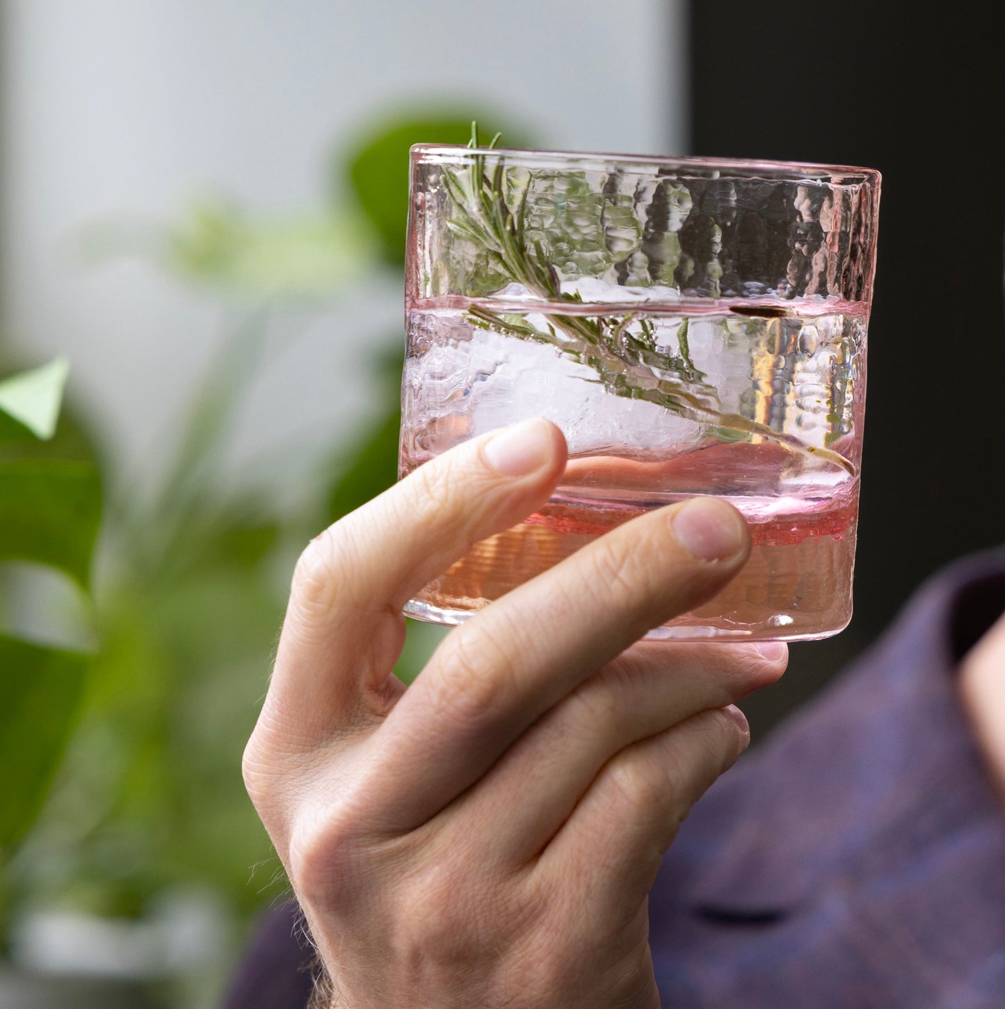 Pink cherry blossom collection rocks glass, hand-blown textured, set of 2, with ice and rosemary.