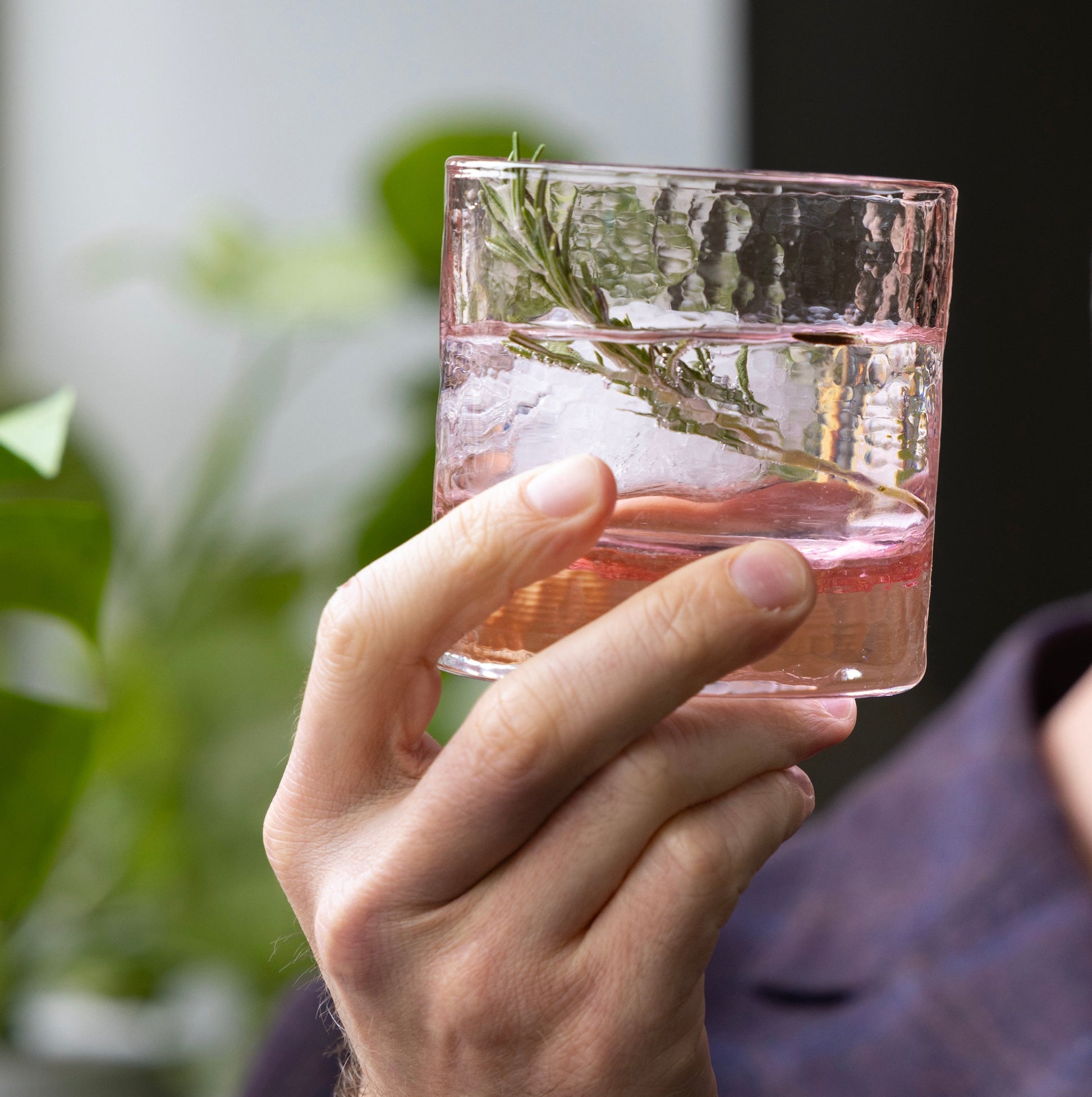 Pink cherry blossom collection rocks glass, hand-blown textured, set of 2, with ice and rosemary.