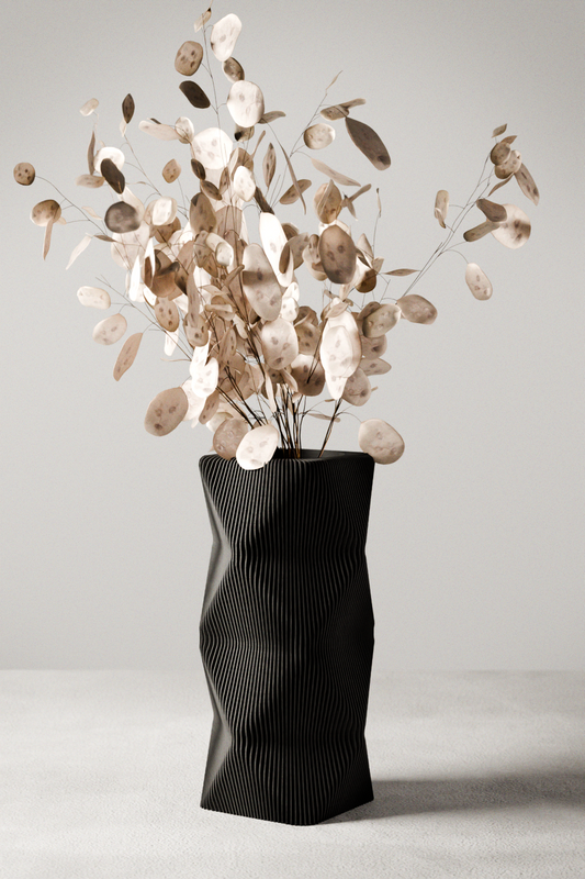 MOUNTAIN Vase: black ribbed ceramic, 9.5 in tall, 5 in outer diameter, 3 in opening, arranged with dried eucalyptus.