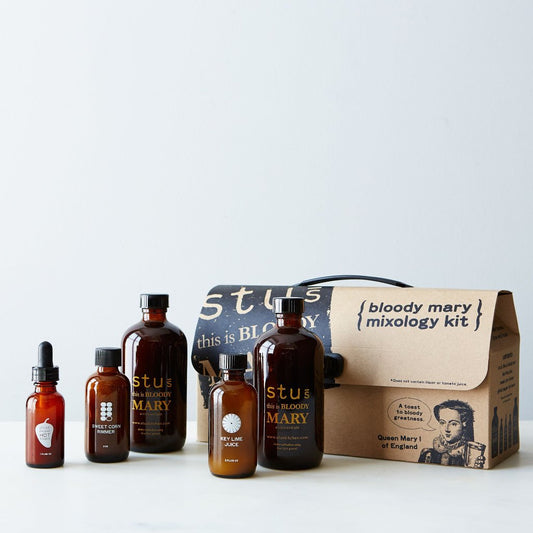 Stu's Bloody Mary Mixology Kit with amber bottles and a labeled box for a DIY Bloody Mary brunch ritual.
