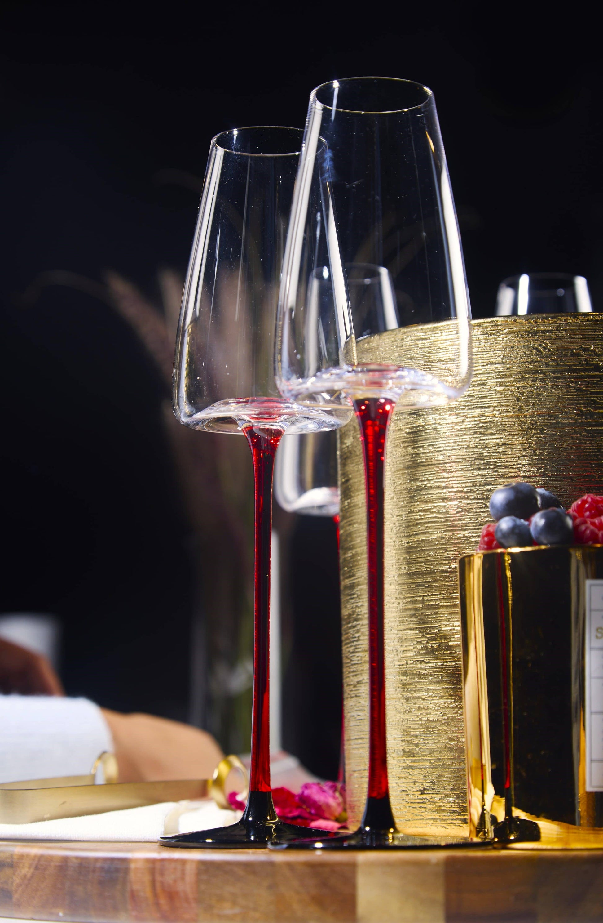 Concave Champagne Glass - 9oz, tall-stem flute with red stems, elegant celebration glassware.
