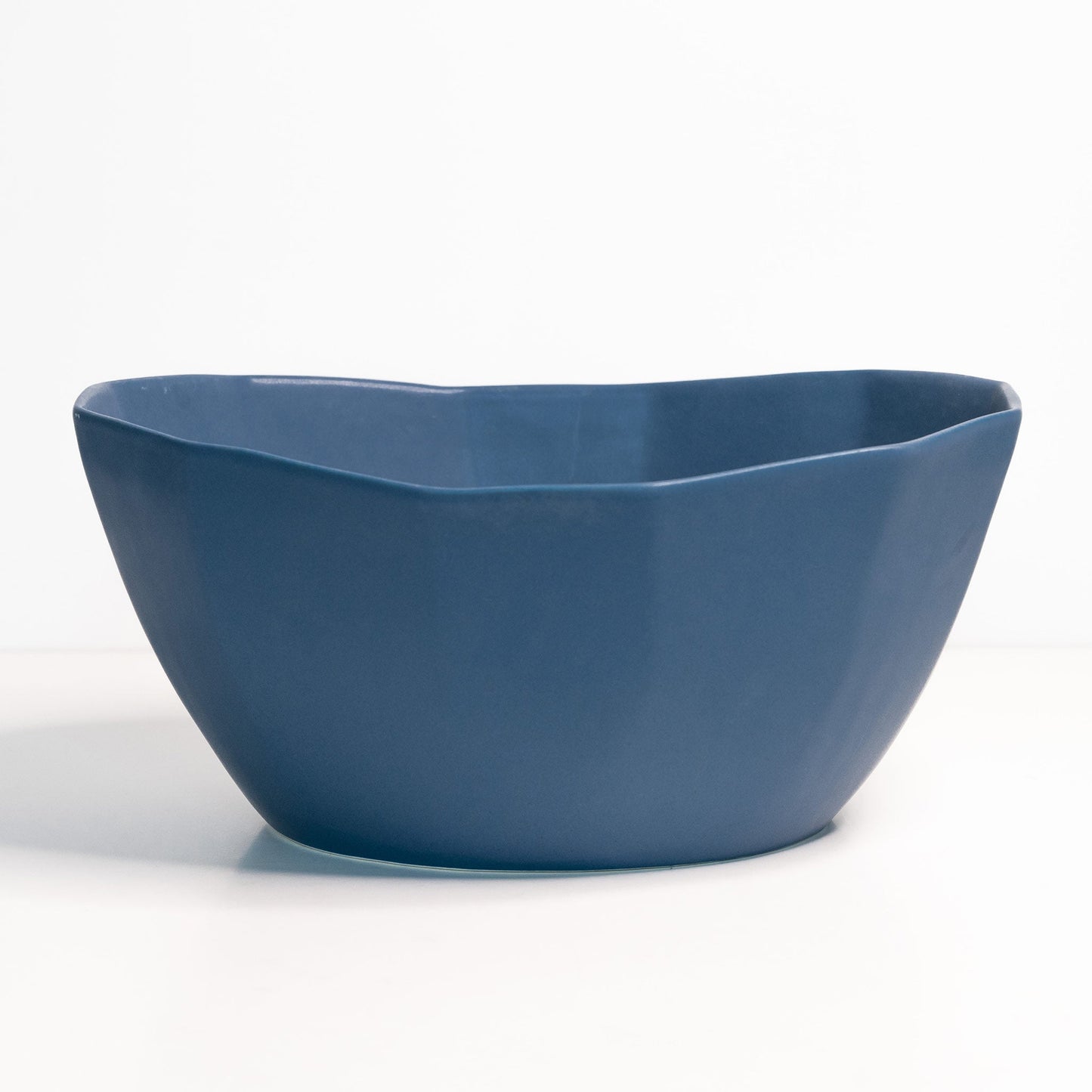 Large Porcelain Nesting Bowl in navy blue, handmade porcelain, ideal for pasta or salads.