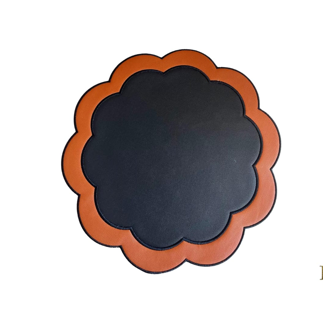 Serenity round black and orange scalloped faux leather placemat, 15.7 inches.