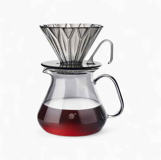 Diamond Pattern Prisma Pour Over Coffee Dripper (PCTG) with rhombic filter on a glass carafe.